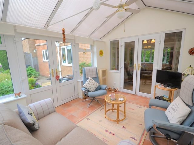 Conservatory - A lovely addition to the property, this UPVC constructed conservatory with double glazed windows and poly carbonate roof built on a dwarf brick wall, having various power sockets, tv aerial point, warm and cool heater, ceramic tiled floor ceiling fan and french doors open to a patio seating area "perfect for entertaining".