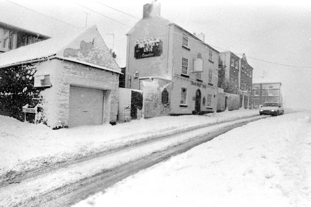 The snowstorms of December 1990 caused chaos throughout the town.
The popular Railway Inn is pictured here covered in snow at the height of the storm.