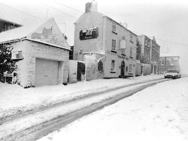 The snowstorms of December 1990 caused chaos throughout the town.
The popular Railway Inn is pictured here covered in snow at the height of the storm.