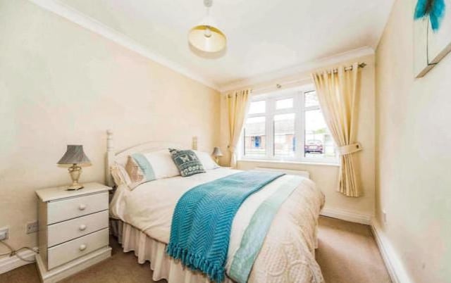 This lovely bedroom is spacious, has plenty of natural light and has been decorated with neutral tones and pops of colour in the bedding for a touch of personality. Two of the three rooms have built in wardrobes and all have double glazed windows.