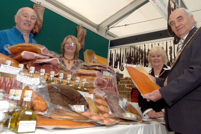 Walter Burrows, right, Chairman of Derbyshire County Council and his wife Elizabeth are presented with a side of locally Smoked Salmon by John and Pauline Jaquest of Bolsover at the Derbyshire Food Fare held at Bolsover Castle in 2006