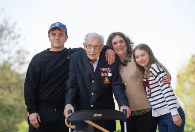 Captain Tom Moore, with (left to right) grandson Benji, daughter Hannah Ingram-Moore and granddaughter Georgia, at his home in Marston Moretaine, Bedfordshire. Picture: PA