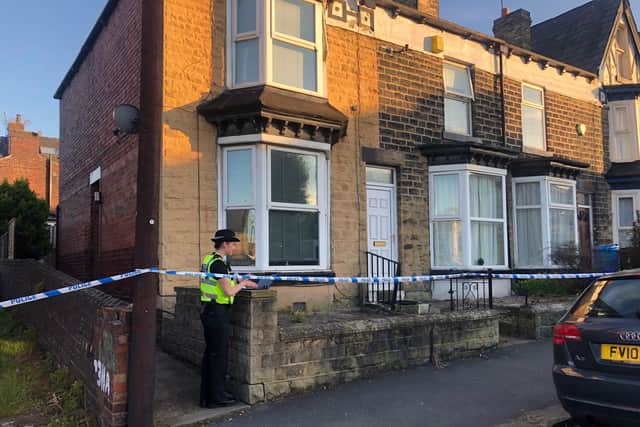 Police on Rockley Road in Middlewood, Sheffield, where a man's body was found in a house