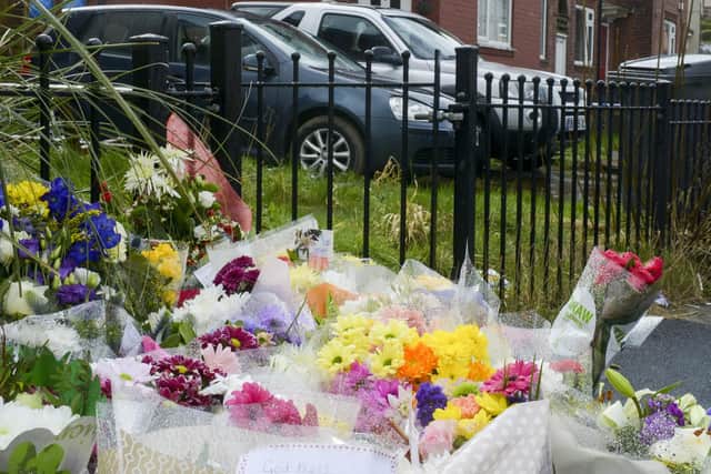 Flowers laid at scene of a murder on Woodthorpe Road in Sheffield