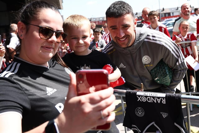 A  fan takes a selfie with Enda Stevens of Sheffield Utd  before the Sky Bet Championship match at Bramall Lane