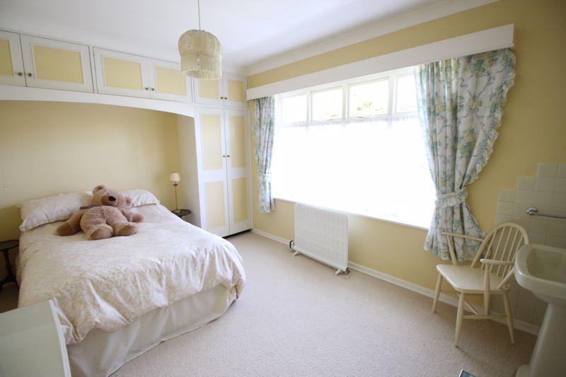Double bedroom with built-in storage.