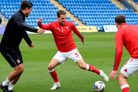 Former Charlton Athletic man Ben Purrington was reported to be of interest to Sheffield Wednesday, but has signed for Ross County.