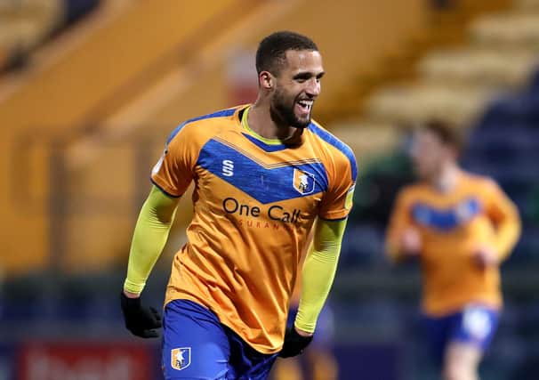 MANSFIELD, ENGLAND - MARCH 09: Jordan Bowery of Mansfield Town celebrates after scoring their sides third goal  during the Sky Bet League Two match between Mansfield Town and Cheltenham Town at One Call Stadium on March 09, 2021 in Mansfield, England. Sporting stadiums around the UK remain under strict restrictions due to the Coronavirus Pandemic as Government social distancing laws prohibit fans inside venues resulting in games being played behind closed doors. (Photo by Alex Pantling/Getty Images)
