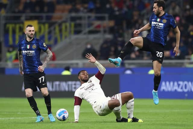 Lys Mousset (C) of Salernitana is challenged by Hakan Calhanoglu (R) and Marcelo Brozovic of FC Internazionale (L)  during the Serie A match between FC Internazionale and US Salernitana (Marco Luzzani/Getty Images)