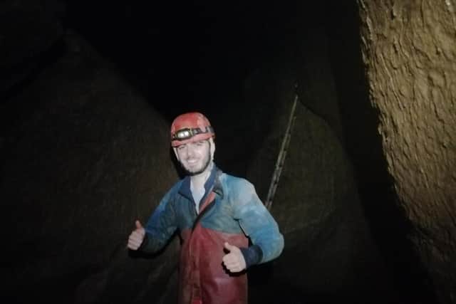 Two thumbs up for the experience! Near Surprise View in the Peak Cavern cave system.