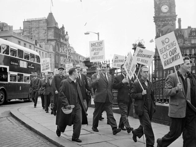 Dr Beeching demonstration - Demonstrators march down Waverley Bridge with slogans ontheir way to meet Dr Beeching - Railway. Protesting against rail cuts.