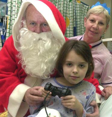 Santa visited the Doncaster Royal Infirmary in 2000 to hand out gifts. Abigail Croft was the recipient of a brand new play station.