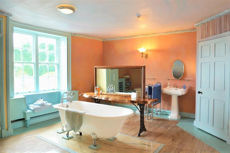 A free-standing bath is the focal point of the bathroom.