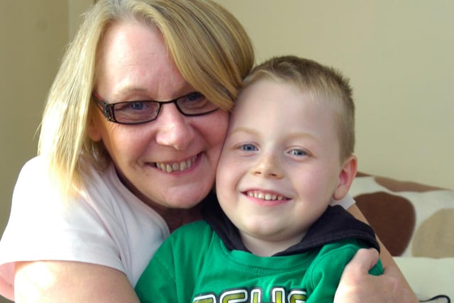 Thomas Cater, five, having hug with grandmother Judith Plant in 2011