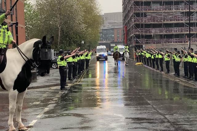PC Rachel Hodgkinson, of South Yorkshire Police's mounted section, is given a guard of honour by colleagues in Sheffield city centre as she prepares to retire after more than 30 years of service. Photo: @PC_Reed via Twitter