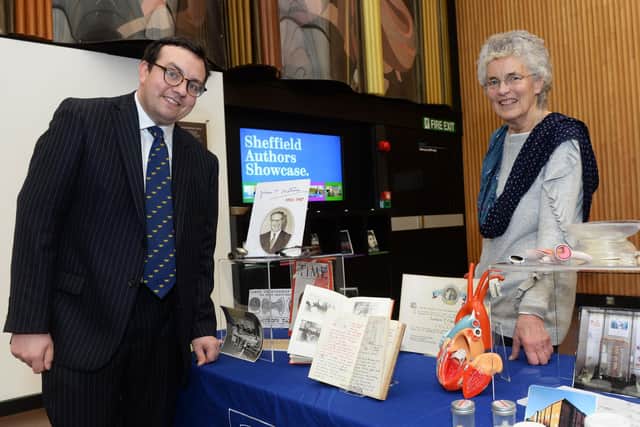 Dr William Parker with Mr Chesterman's daughter Rosemary Stow and some of the research