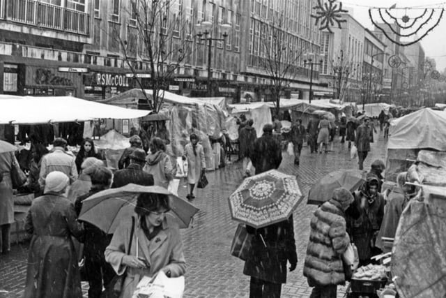 Christmas shopping at the Outdoor Market on The Moor in Sheffield city centre in 1980