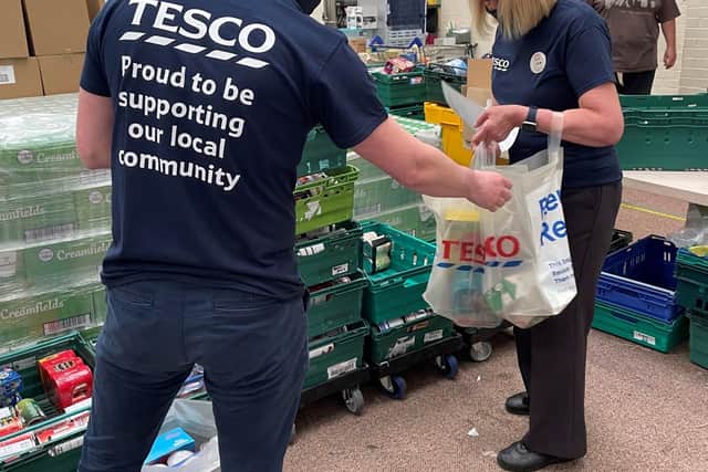 Volunteers from Tesco give their time to help out at the S6 Food Bank.