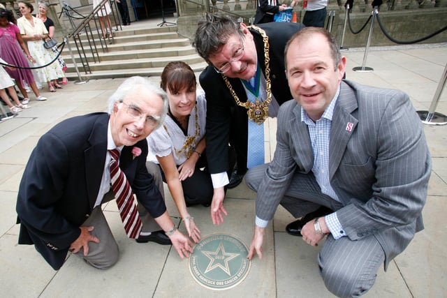 Internationally-acclaimed expert in the treatment of cancer, Professor Barry Hancock, left, unveiling his Sheffield Legends plaque outside the Town Hall in 2011