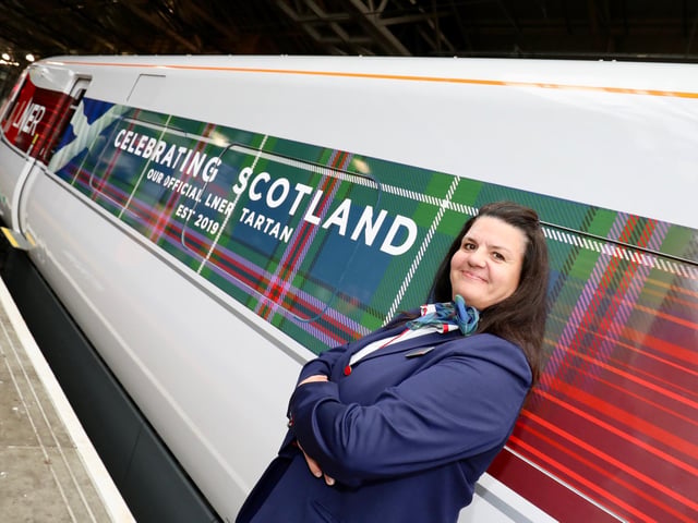 LNER launches its very own official tartan, as worn by staff, and displayed on the side of this train.
