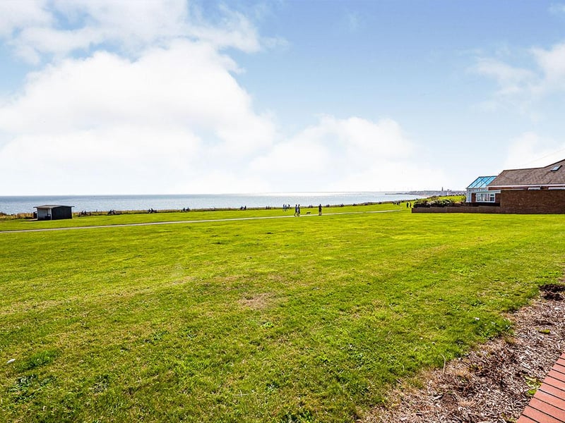 A patio area provides space to sit and admire the "absolutely breath-taking panoramic sea views".