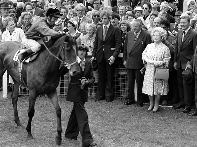 The Queen Mother smiles as Dunfermline, ridden by Willie Carson walks past the paddock after winning the Jubilee Oaks race at Epsom.