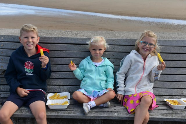 You can't beat chips at the seafront! Youngster Thomas Craig, nine, and sisters Sadie three, and Isabella, seven, enjoying chips in the sun.