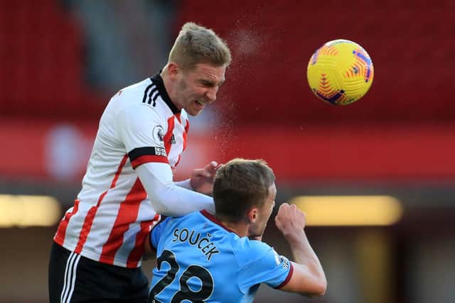 Sheffield United's Oli McBurnie (L) and West Ham United's Tomas Soucek (R) go up for a header during the Premier League match at Bramall Lane    (Photo by MIKE EGERTON/POOL/AFP via Getty Images)