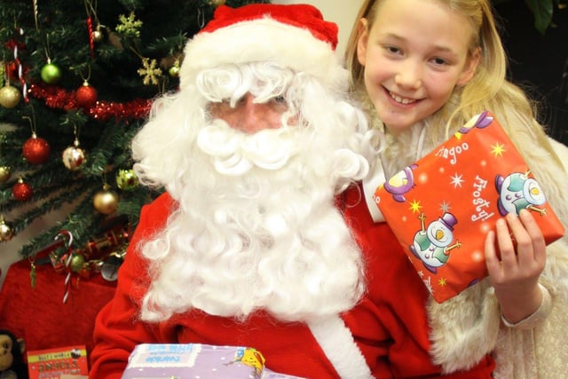 Santa and the snow princess 10 year old Katie Murphy at Ashgate Hospice christmas market in 2010