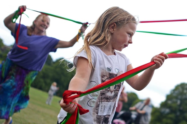 Learning traditional Maypole dancing Penny's Merry Maypole at Graves Park in August 2018