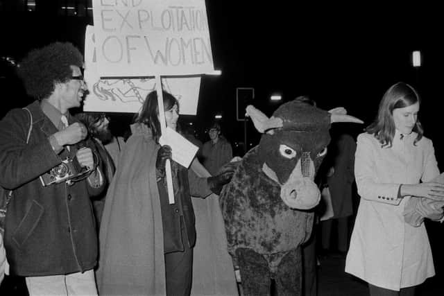 Activists and members of the 'Women's Liberation Movement' protest against the Miss World Beauty Pageant using a pantomime cow outside the Royal Albert Hall where the contest was held, London, UK, 20th November 1970. (Photo by Pierre Manevy/Daily Express/Hulton Archive/Getty Images)
