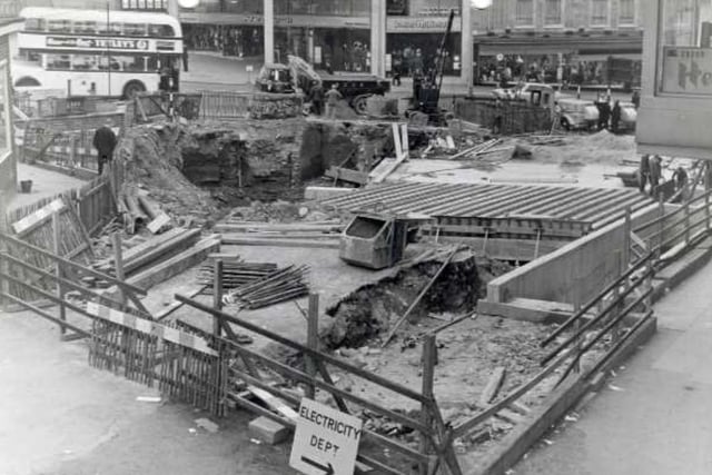 Sheffield's Hole in the Road, at Castle Square in the city centre, under construction in 1965. This photo was taken looking towrds the Peter Robinson Ltd fashion department store on High Street.