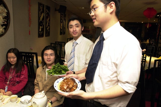 Waiters Malcolm Kok and Ho Keat Chan serve at the Marble Court restaurant, at Rockingham Gate, Sheffield, in March 2003