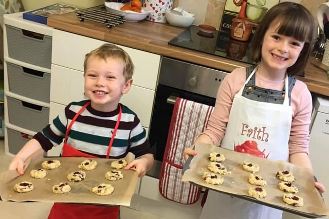 Leo and Faith show off their Christmas cookies.