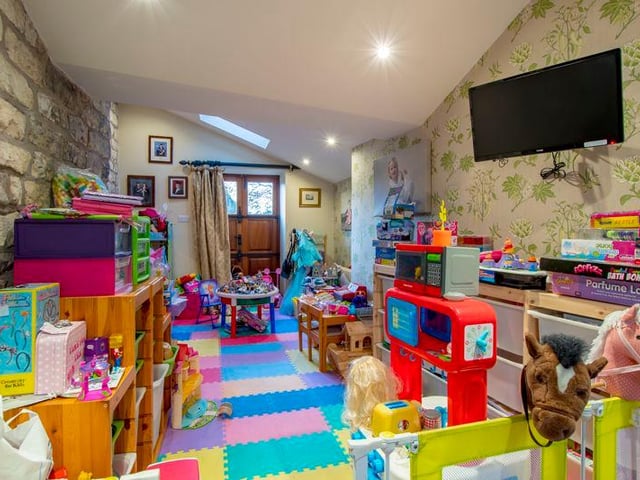 The family room is currently being used as a play room.