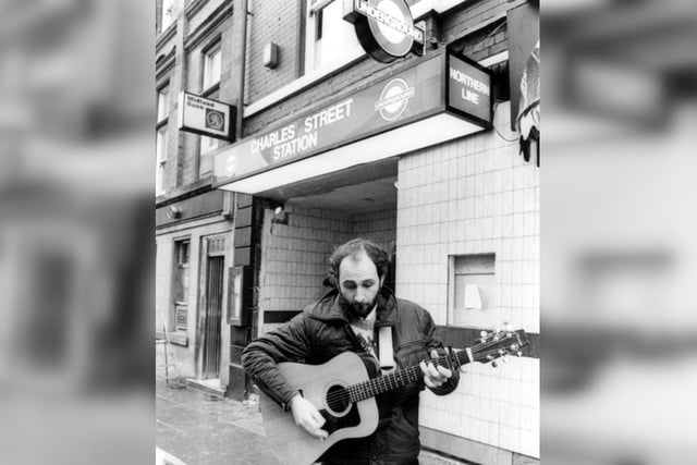 Stephen Shephard busking outside Charles Street Station pub in Sheffield city centre in March 1983. Charles Street Station was a theme pub in the style of a London Underground station, including tunnels and escalators.