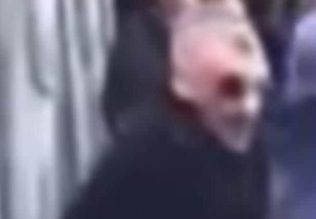 South Yorkshire Police want to speak to this man about trouble before a Sheffield Wednesday fans. But people who have seen the pictures say he looks like a character from a horror film. This is a close up on his face.