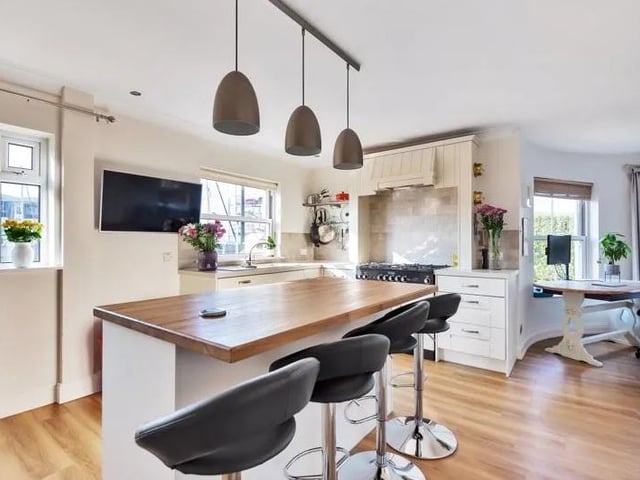 This four bedroom terraced home with views over Camber Dock, Old Portsmouth is on sale for £950,000. Here is the open plan kitchen.