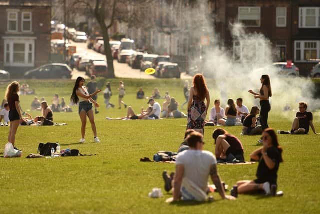 People enjoy the sunshine in Endcliffe Park in Sheffield (Photo by Oli SCARFF / AFP) (Photo by OLI SCARFF/AFP via Getty Images)