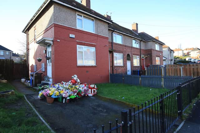 Flowers at the house where Jordan Marples-Douglas was stabbed to death on Woodthorpe Road in Sheffield.