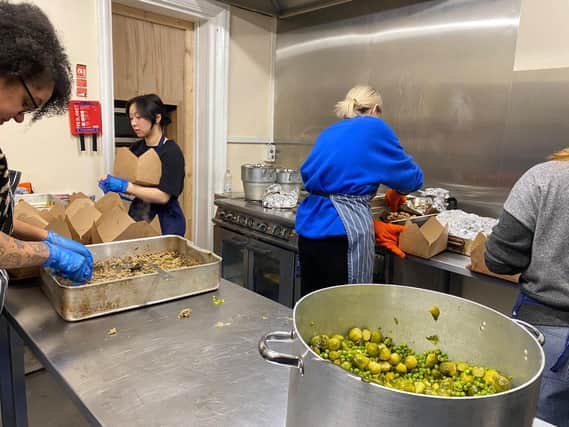 A team of volunteers prepare fresh meals every Sunday