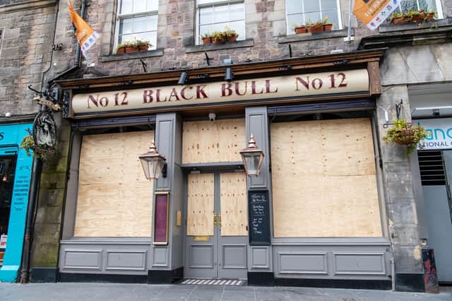 The Black Bull in Grassmarket, Edinburgh, is one of the many pubs in the city to be boarded up during the pandemic