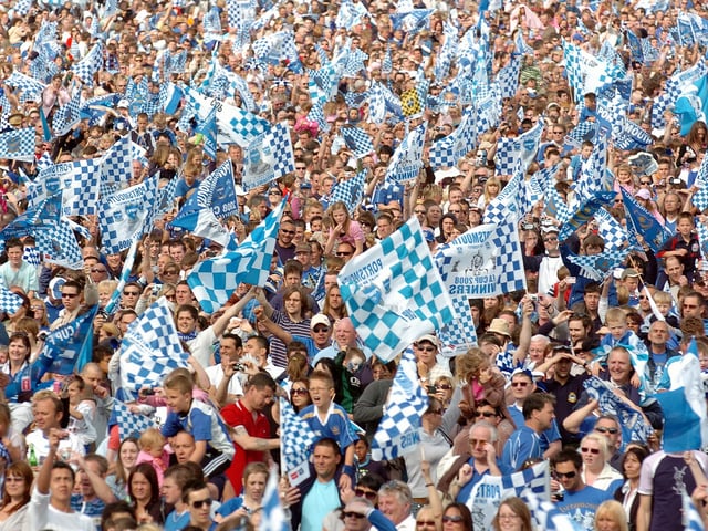 A mass of blue flags as fans celebrate Pompey's FA Cup victory. Picture: Malcolm Wells 082235-261