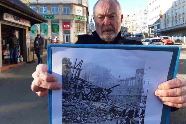 Local historian Martin Naylor in front of the pawn shop that now occupies the site of the Marples Hotel, with a picture showing the wreckage of the hotel after the Sheffield Blitz. He wants to see a blue plaque to mark the site