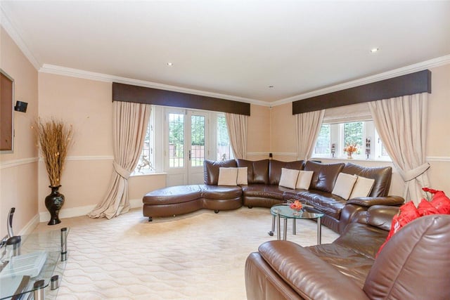 A further family sitting room provides an additional area for relaxing and entertaining, with the double doors leading out into the private rear garden.