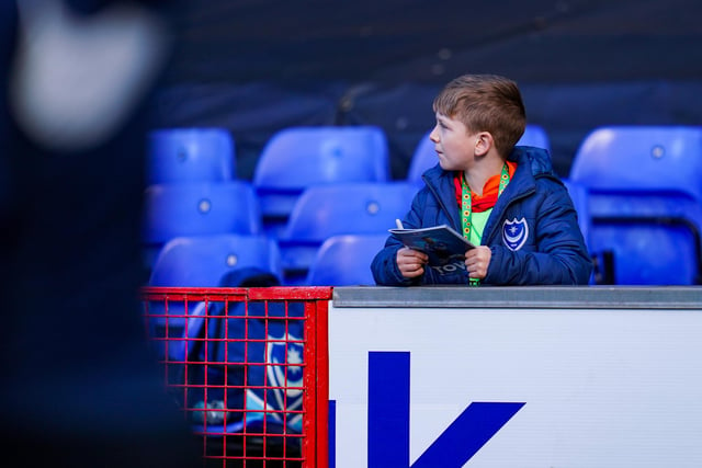 This young Pompey fan gets pitch side looking for a few autographs