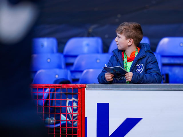 This young Pompey fan gets pitch side looking for a few autographs