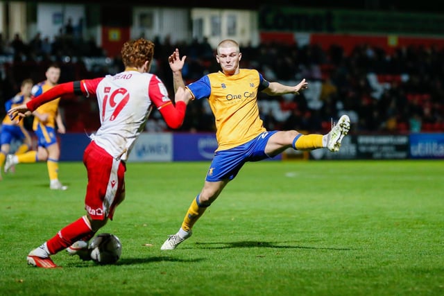 Mansfield Town midfielder Ryan Stirk blocks a pass.