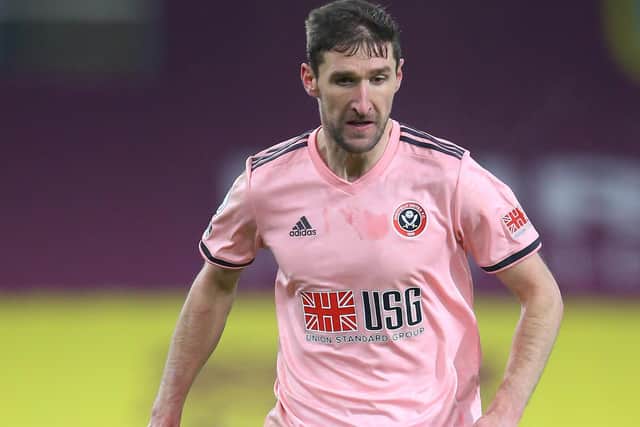 Chris Basham of Sheffield United runs with the ball  (Photo by Alex Livesey/Getty Images)