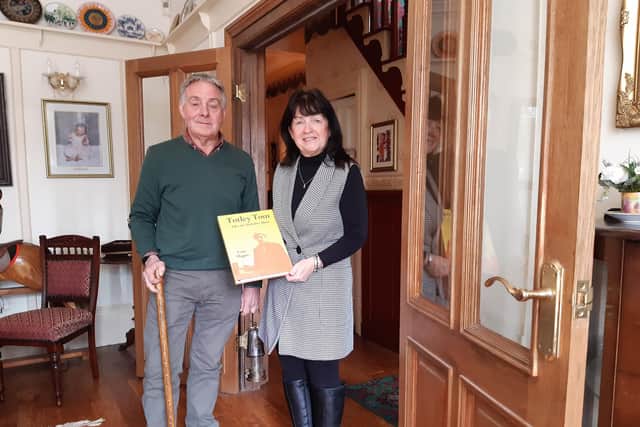 Russell Hague and Sharon Hall, grandchildren of Totley Tom, with his book and memorabilia